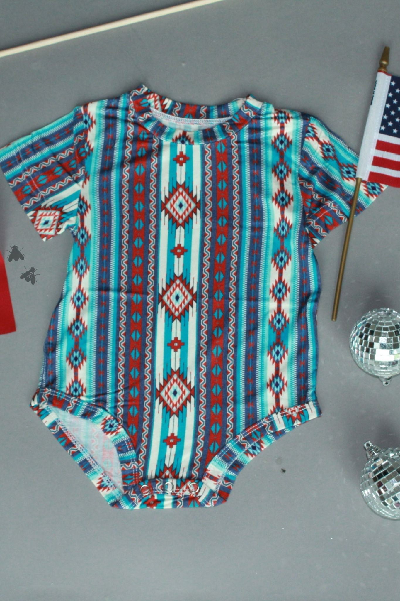 KIDS IN AMERICA ONESIE