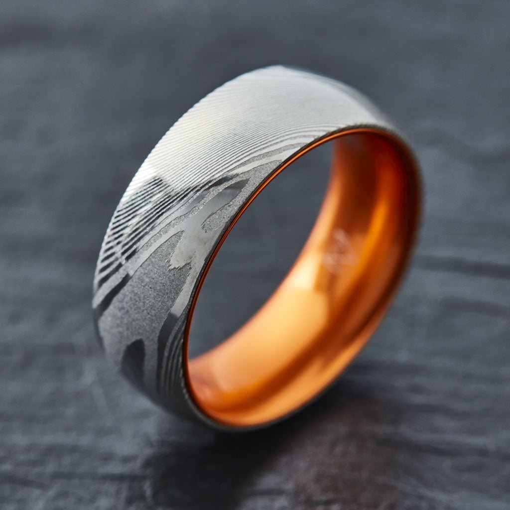 Wood Grain Damascus Steel Ring - Resilient Orange