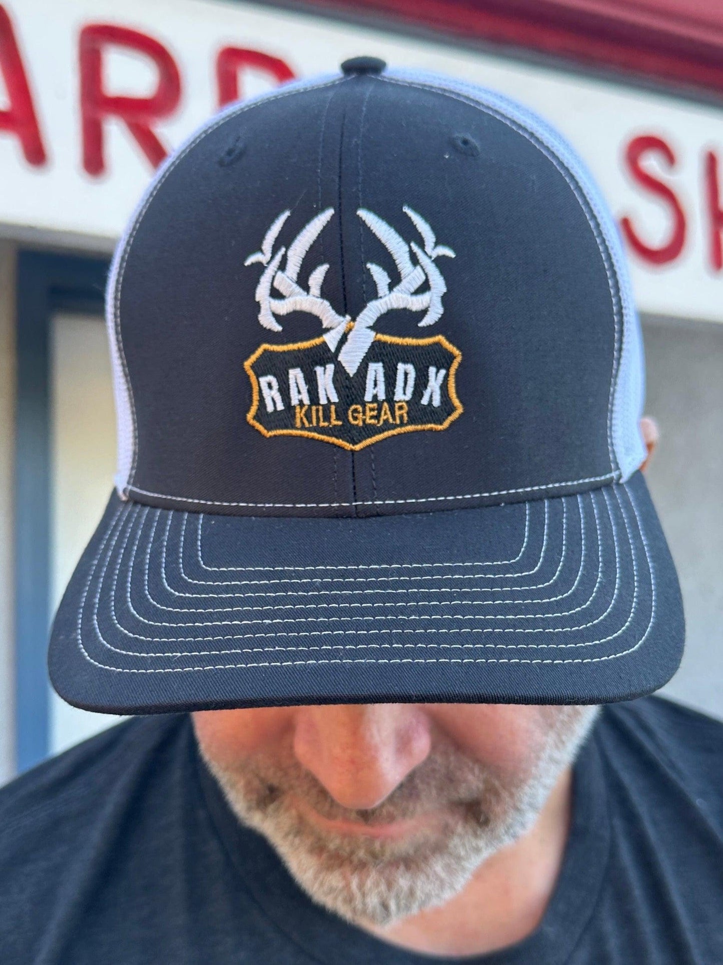 RakAdx Trophy Plaque Trucker Hat